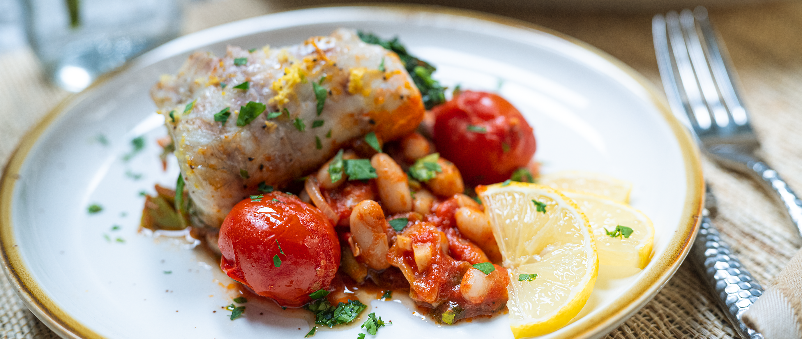Carmelina Branzino Roulade with Spicy Cannellini and Cherry Tomato Sauce